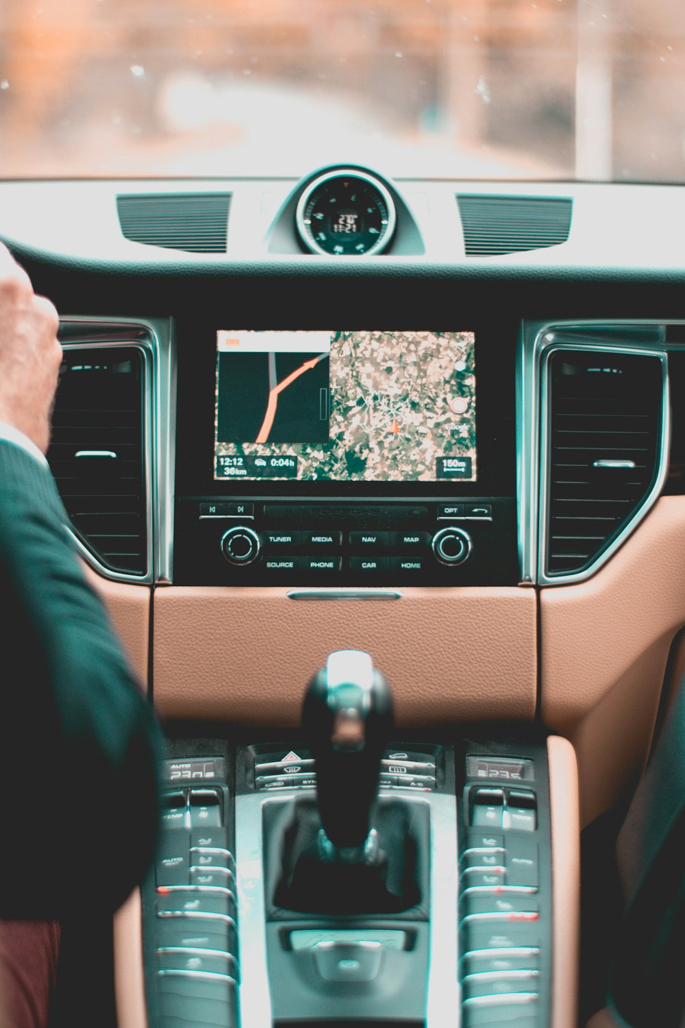 person holding steering wheel