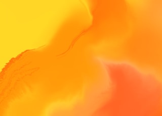 a close up of a yellow and orange background