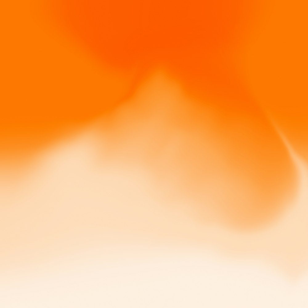 オレンジと白の背景のぼやけた画像