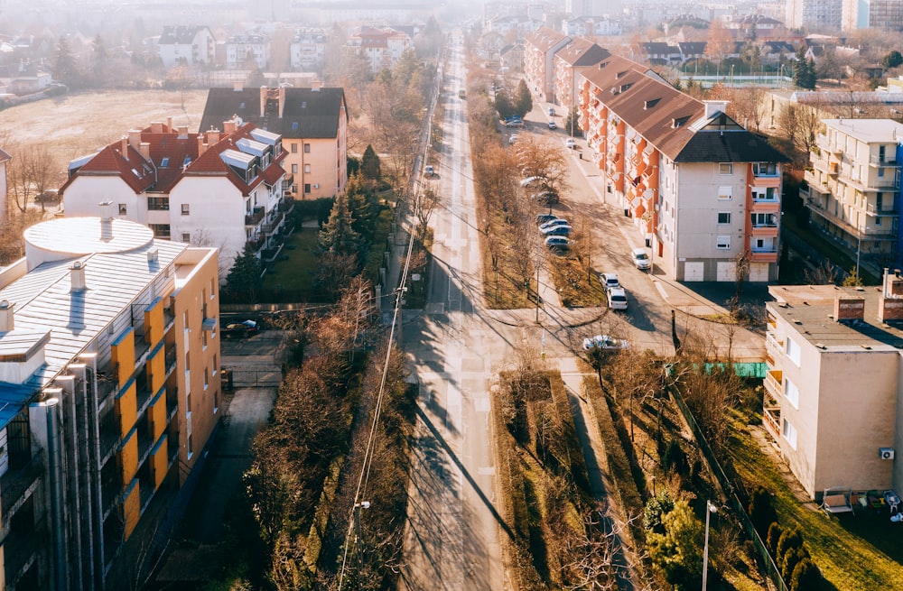 empty road between houses and buildings