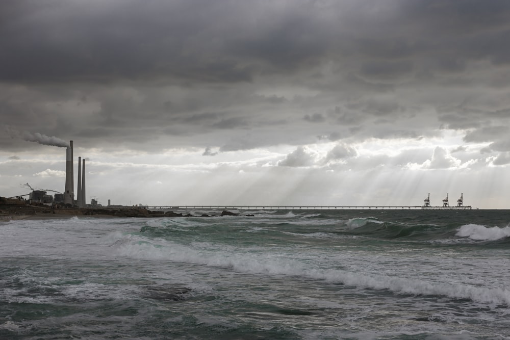 body of water under gray sky