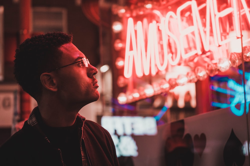 man looking to a LED sign