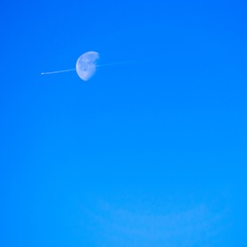 jet smoke over moon