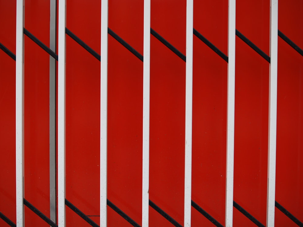 a red wall with white and black lines on it