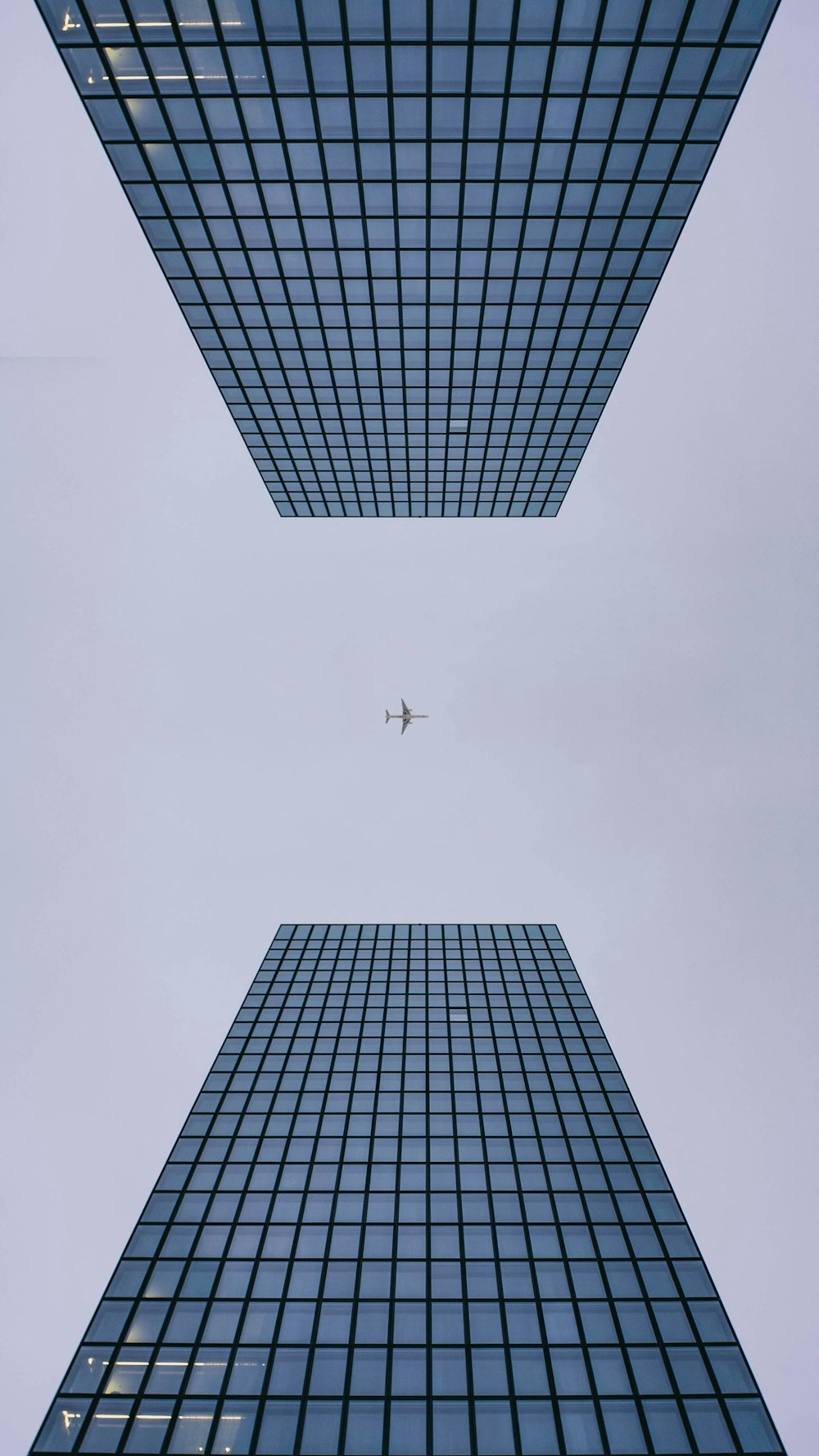 low angle photo of curtain glass wall building