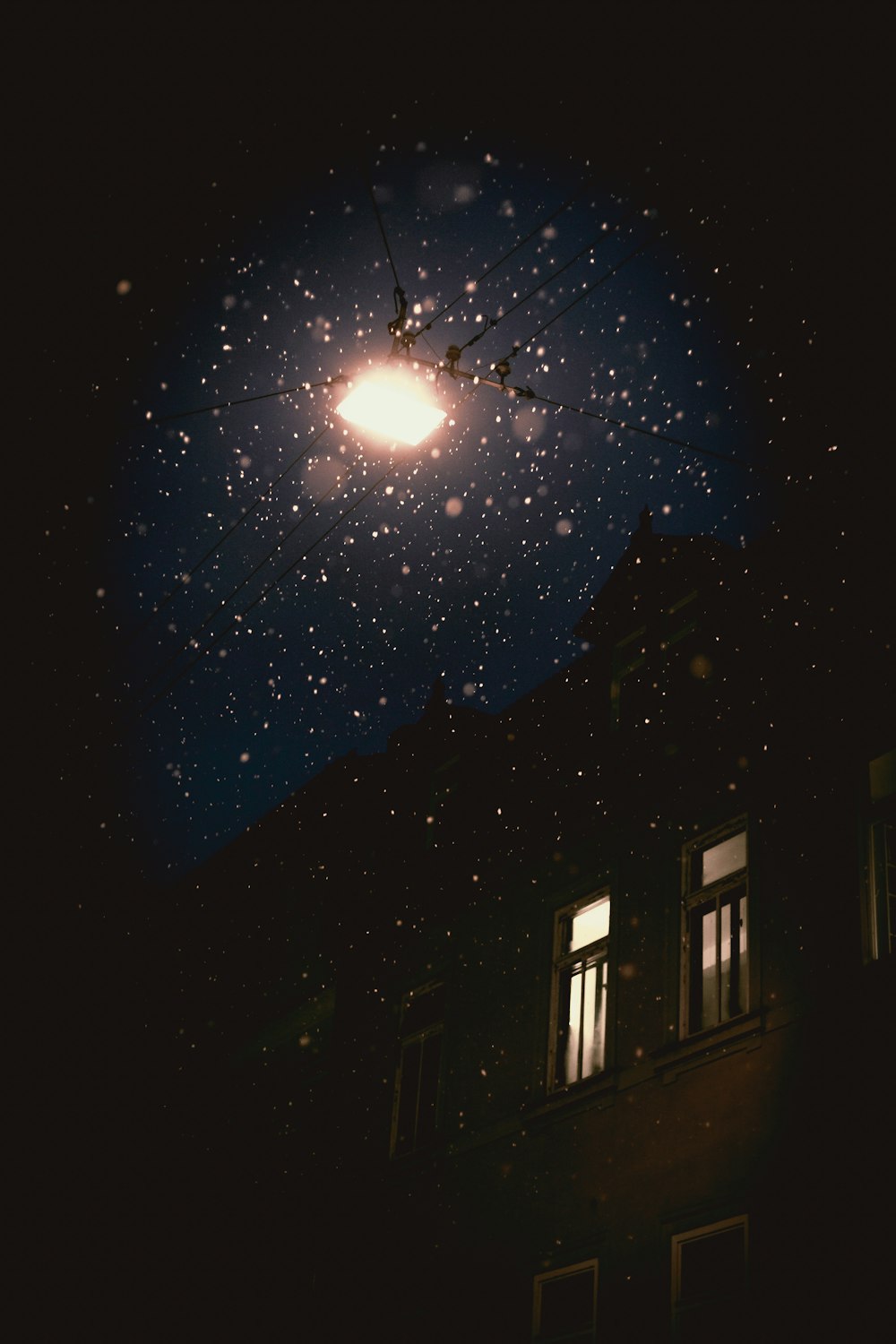 lighted building under moon at moon