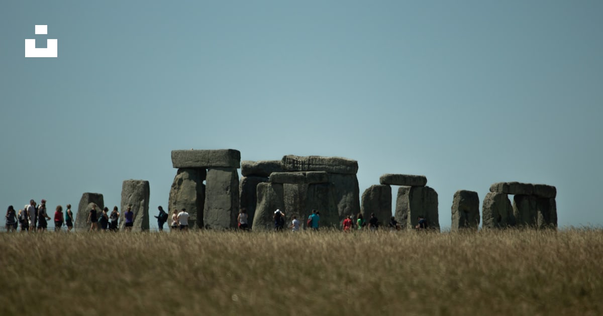 People on rock formation during daytime photo – Free Stonehenge Image ...