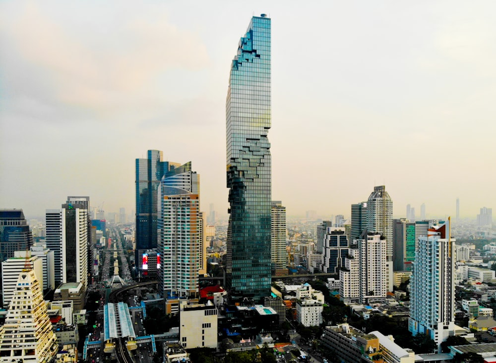 curtain wall high rise building under white sky