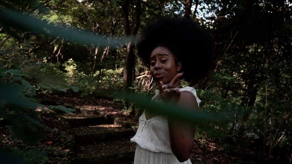 woman standing under tree during daytime