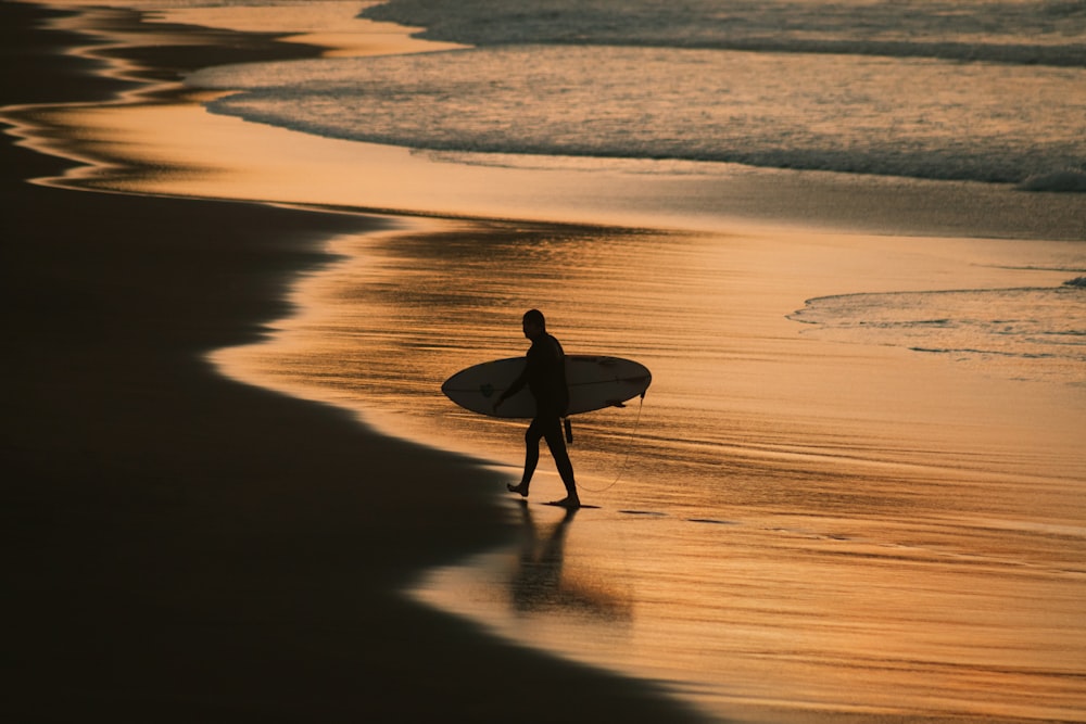 man holding surfboard