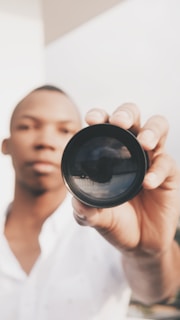 Oval-shaped credential photo with a soft-focus background highlighting the subject