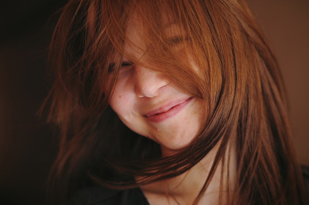 smiling woman in black shirt