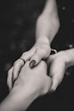 selective focus of man and woman holding hands