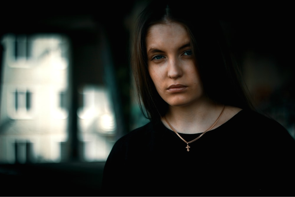 selective focus photography of woman wearing black shirt