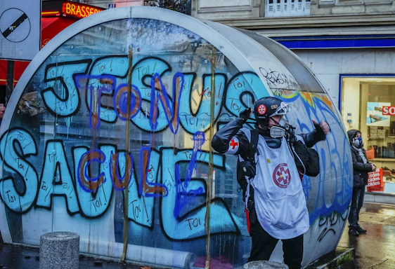 A friendly customer service representative wearing a headset, ready to assist with graffiti removal inquiries.