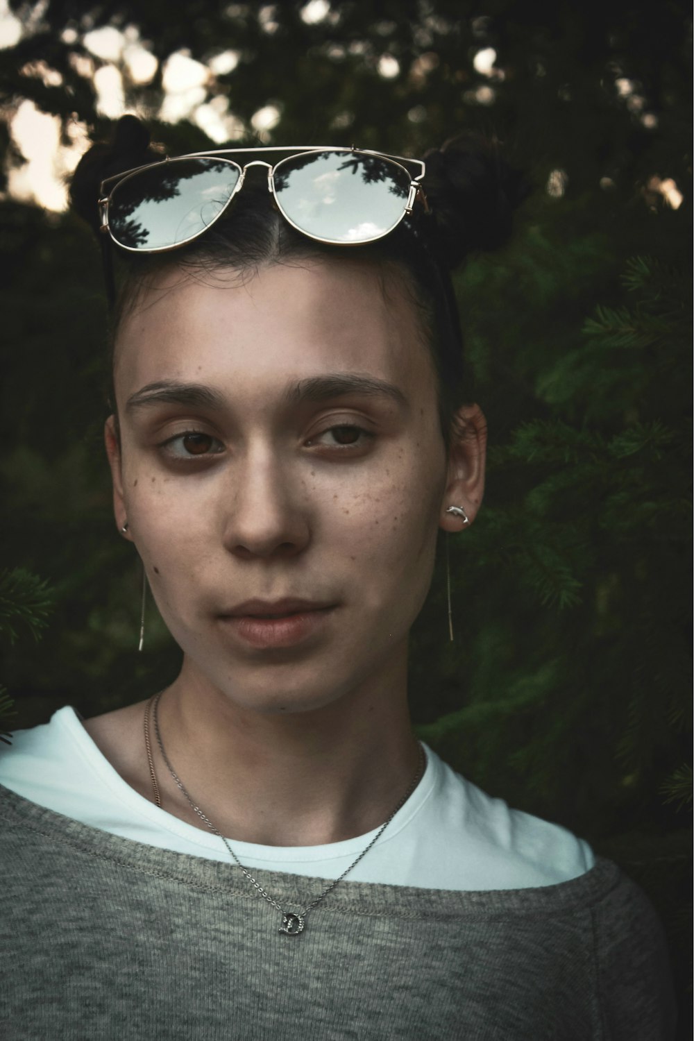 woman wearing gray and white crew-neck shirt