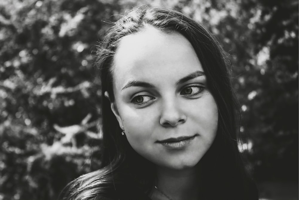 grayscale photography of woman smiling