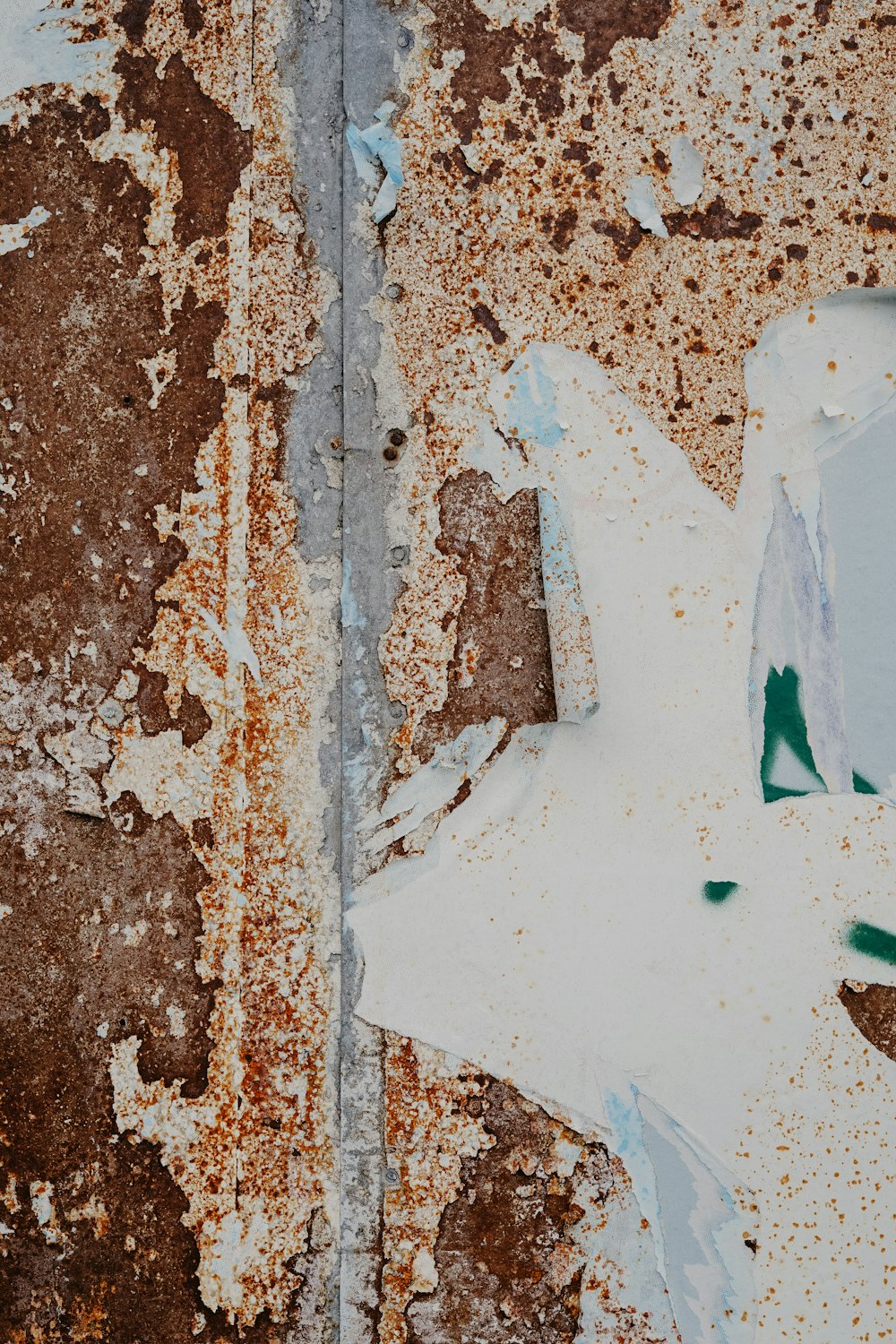 a rusted metal surface with a star painted on it