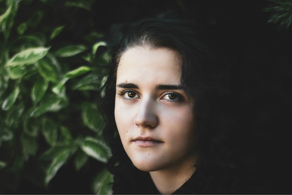 selective focus photography of woman wearing black shirt