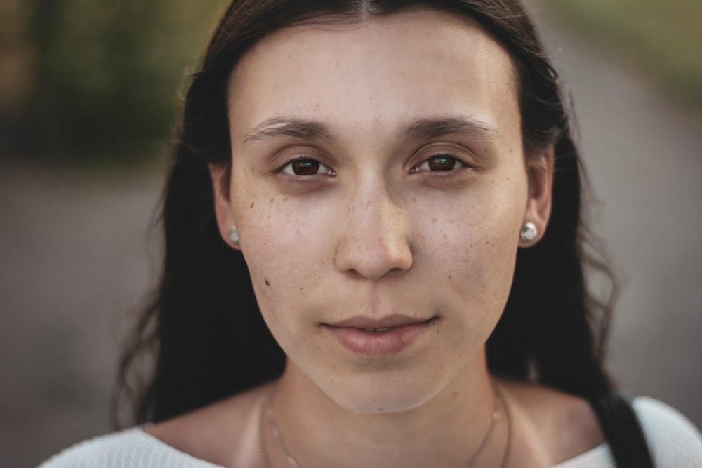 selective focus photography of woman wearing white shirt