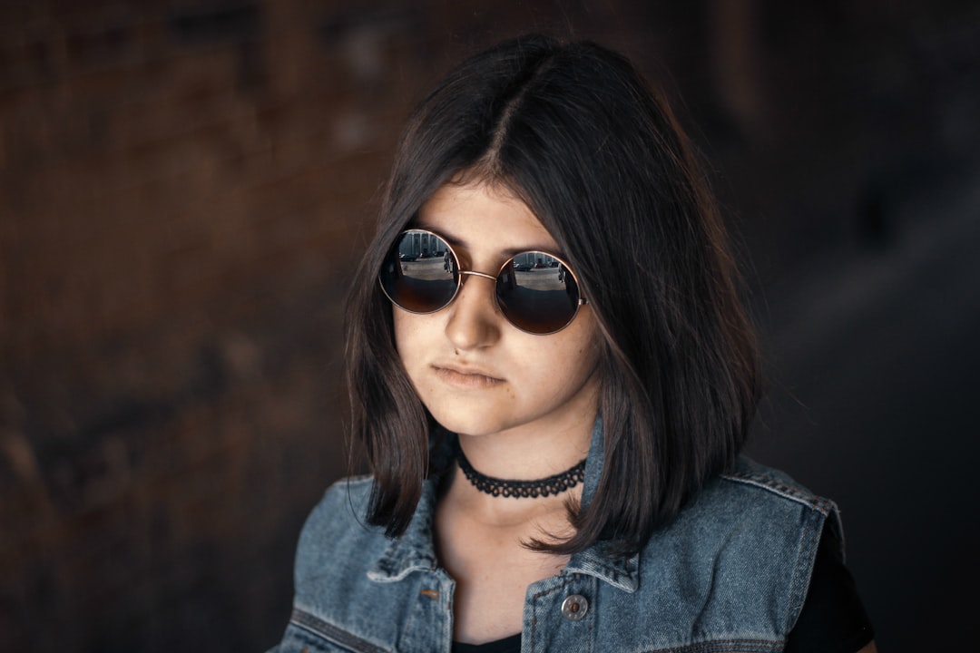 woman wearing sunglasses close-up photo