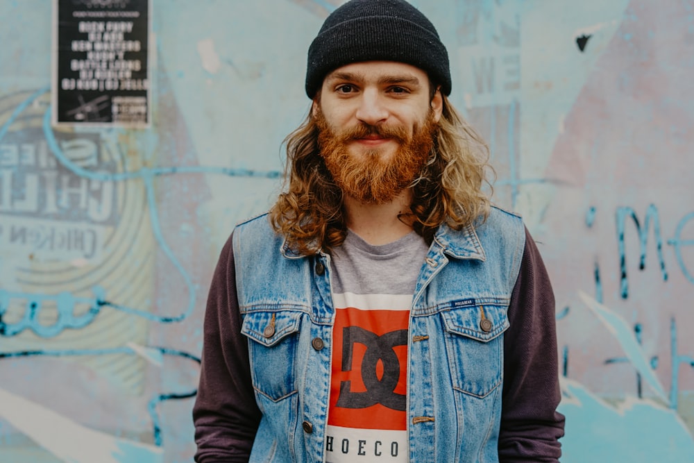 man in blue denim vest