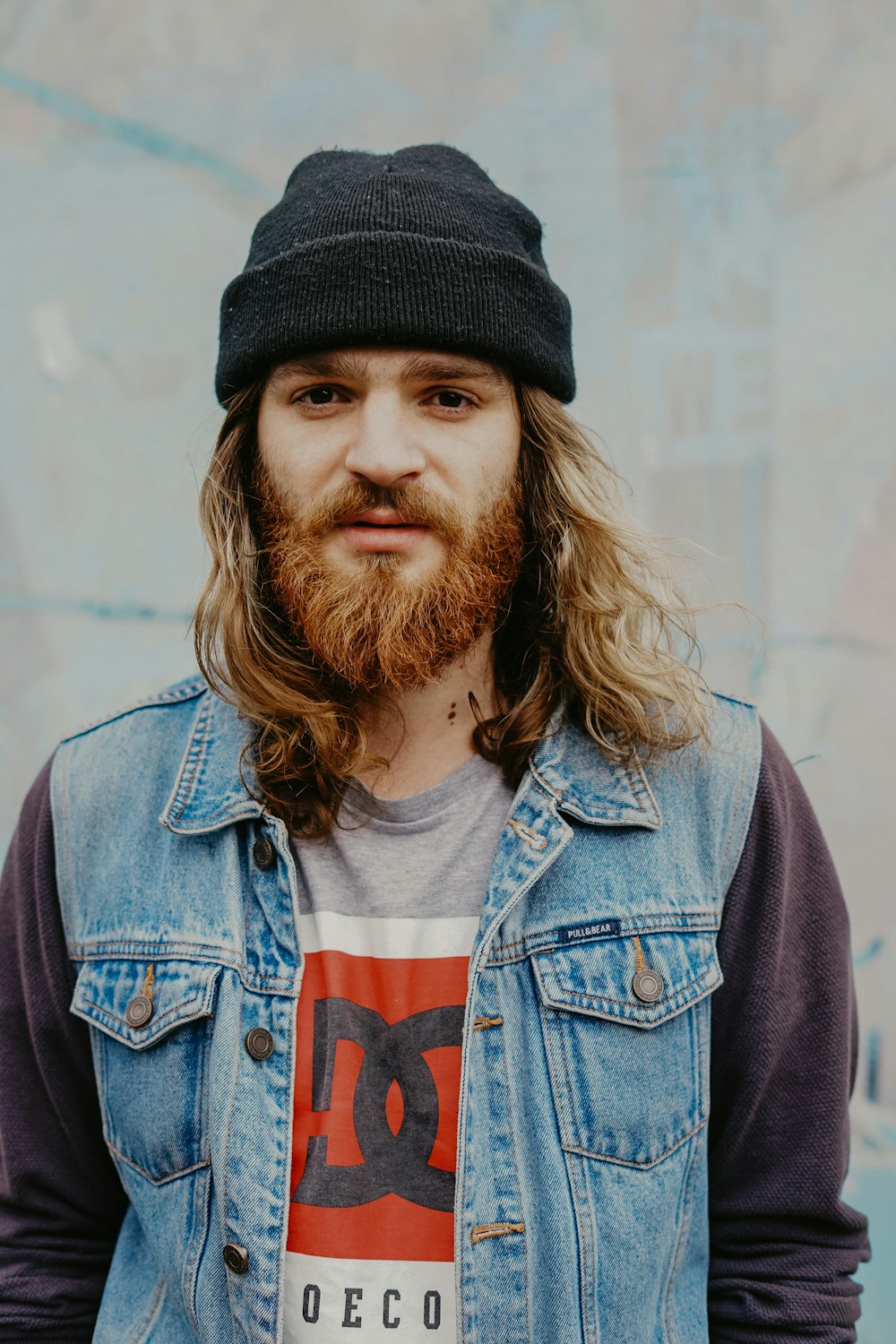 man wearing blue denim jacket close-up photo