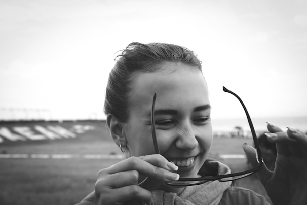 Smiling patient after successful refractive eye surgery.