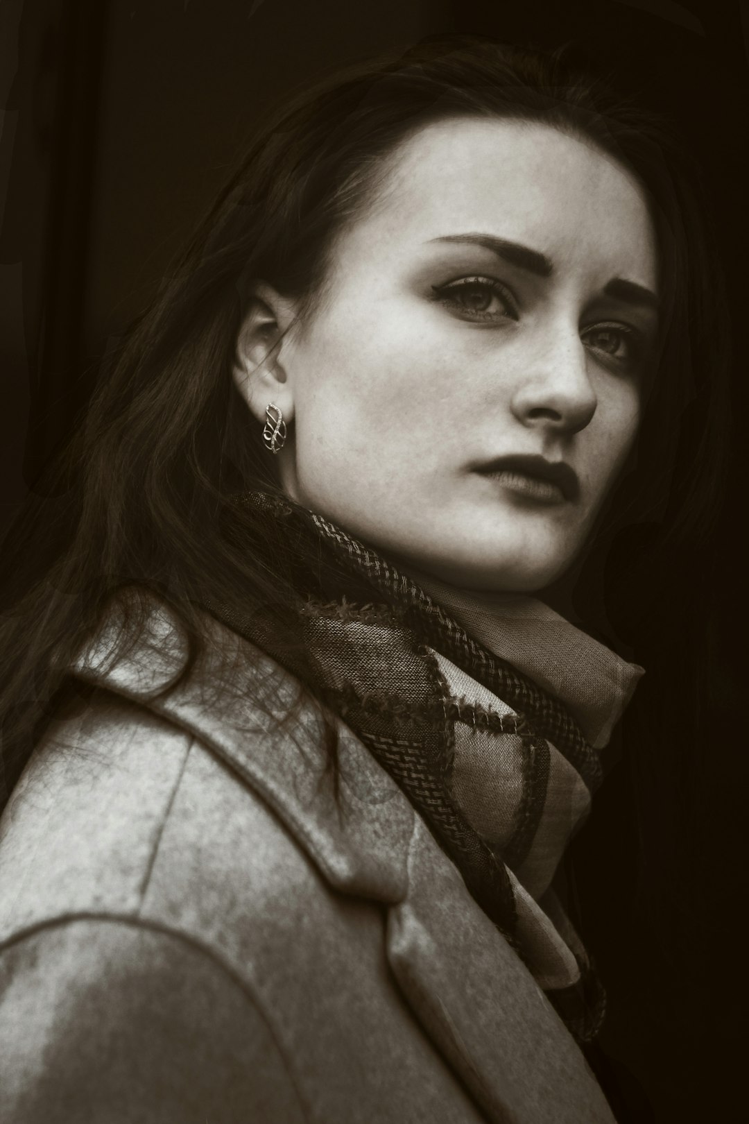 grayscale photography of woman wearing suit jacket