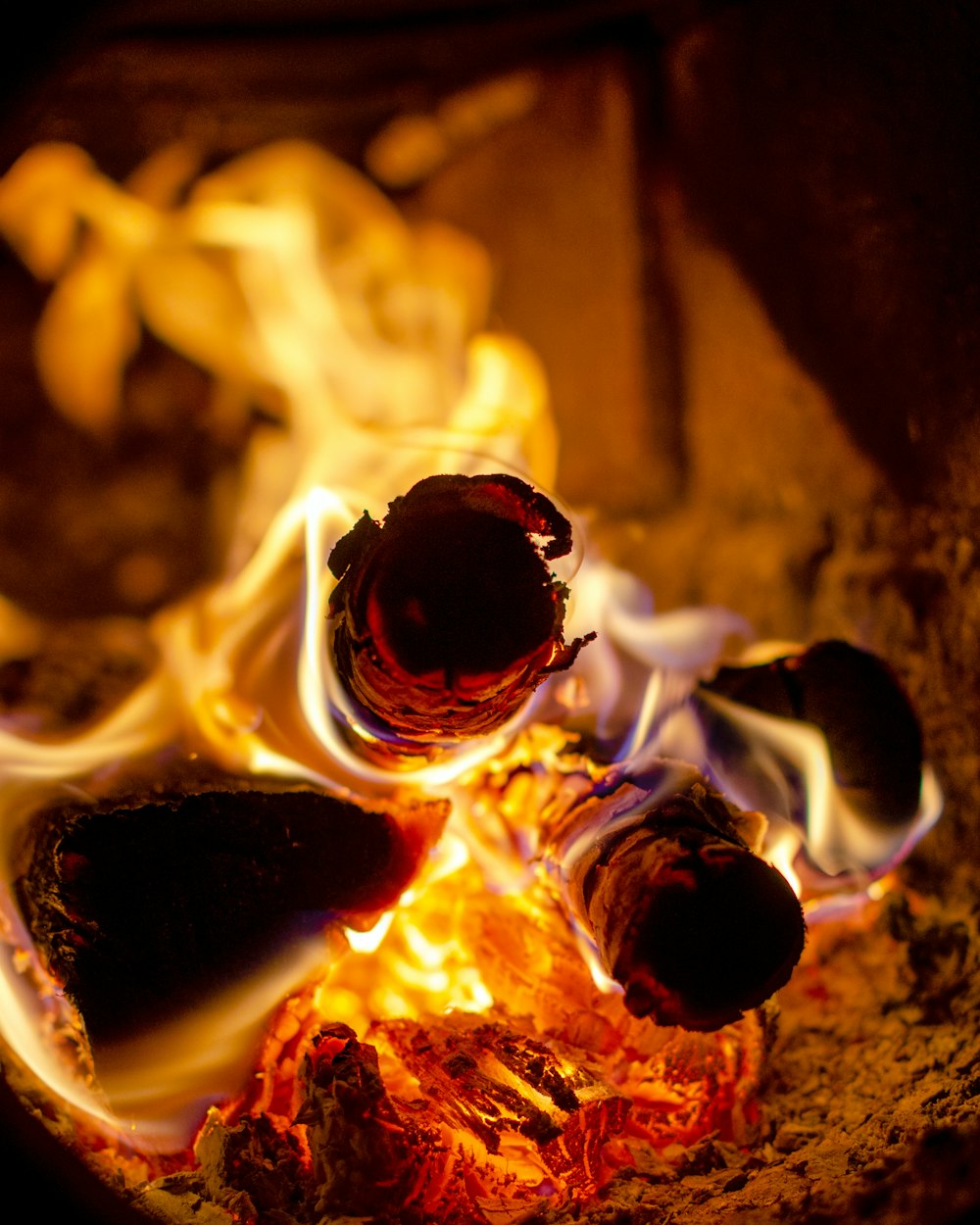 selective focus photography of wood with fire