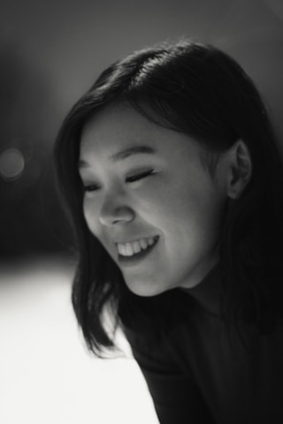 A portrait of Angie Martinez smiling, representing youth engagement.