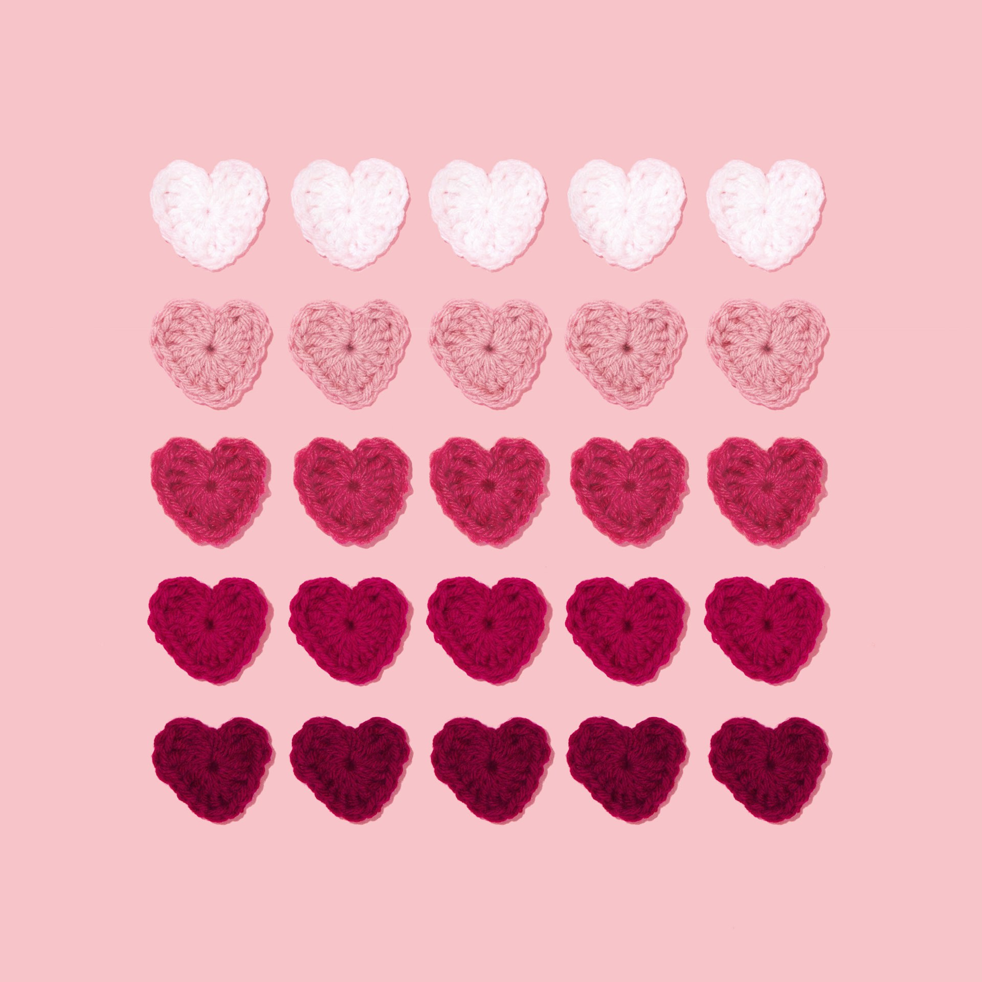 five rows and columns of knitted hearts