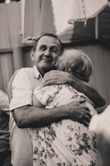 A joyful couple reunited in a warm embrace.