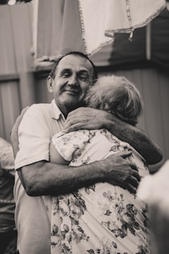 A joyful couple reunited in a warm embrace.