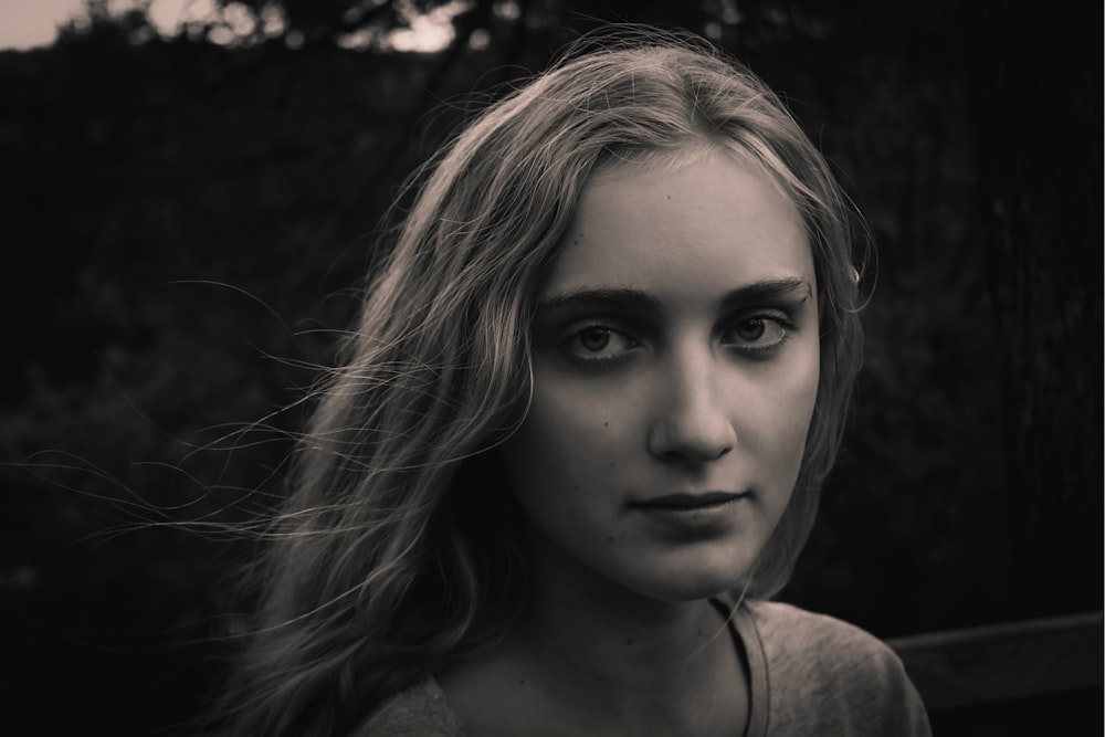 greyscale photo of woman wearing shirt