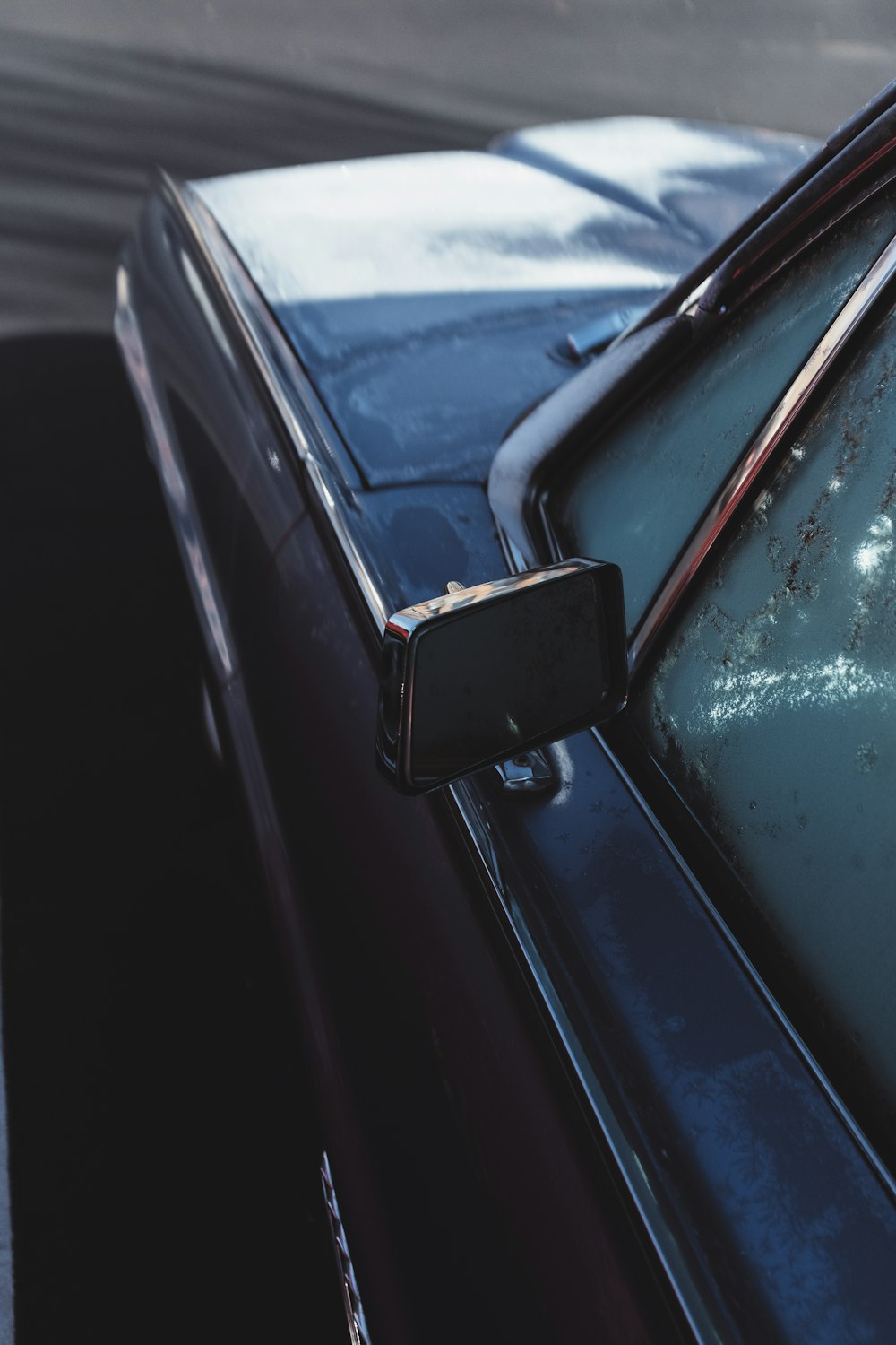 silver car with rectangular side mirror