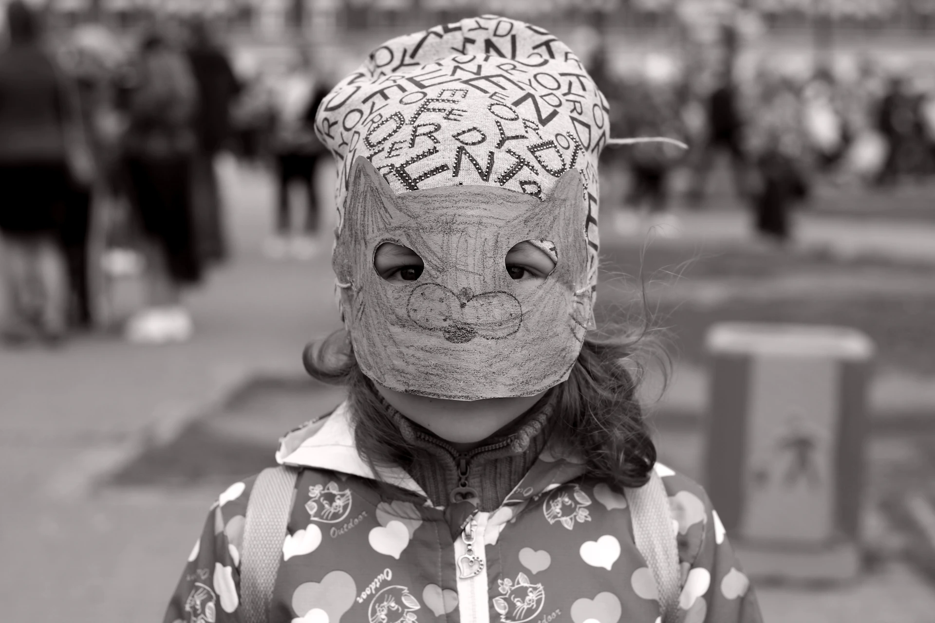 girl standing while wearing mask
