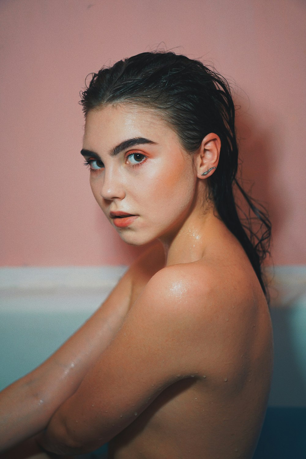 topless woman on bath tub