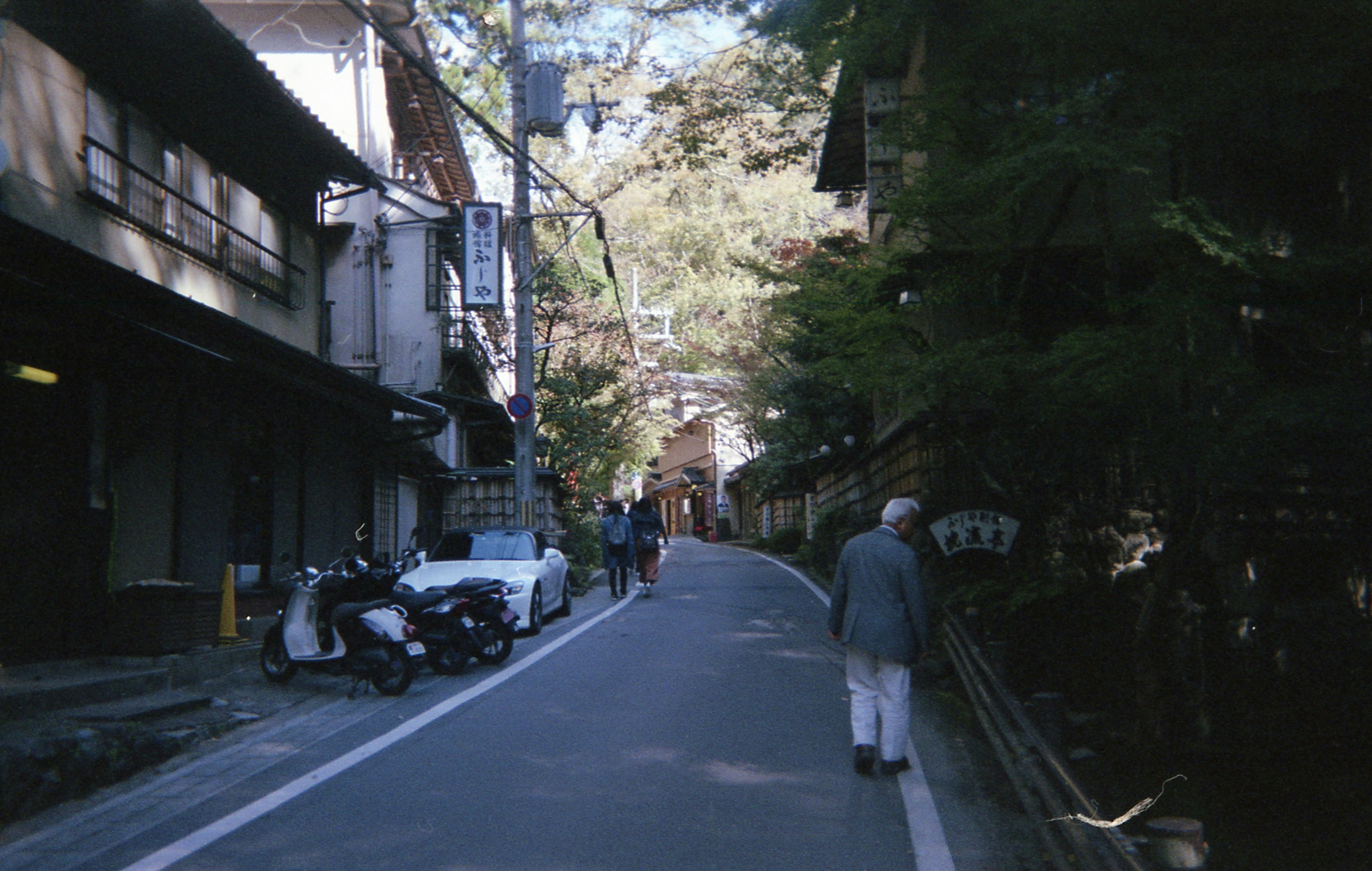 men walking on sidewalk near building