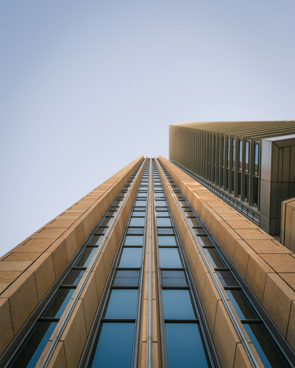 low angle photography of brown high-rise building during daytime