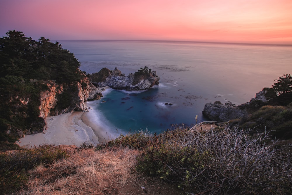 calm body of water during golden hour