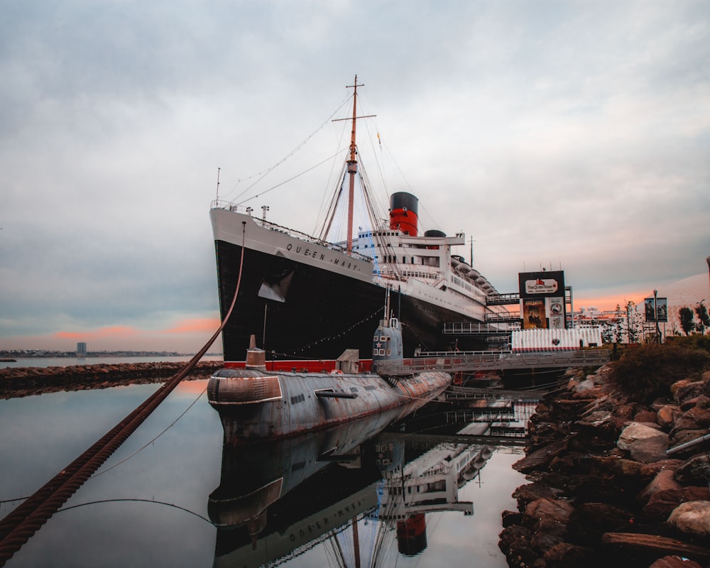 submarine and black ship on port