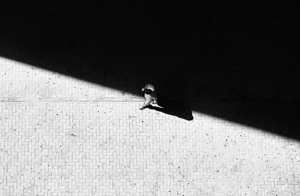 man walking through concrete street