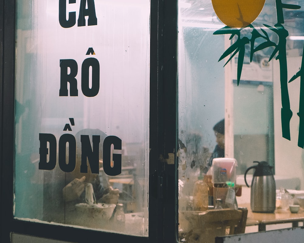 woman leaning on door inside building