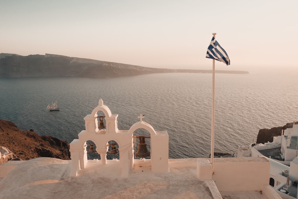 white concrete building near sea during daytime