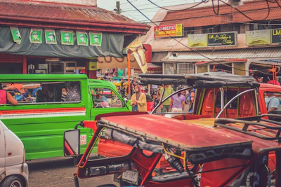A vibrant street scene in the Philippines with a vendor selling branded gulapings merchandise.
