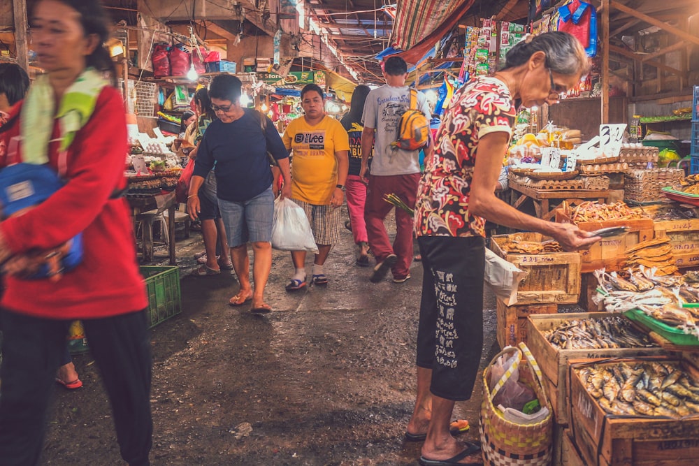 people walking on market store