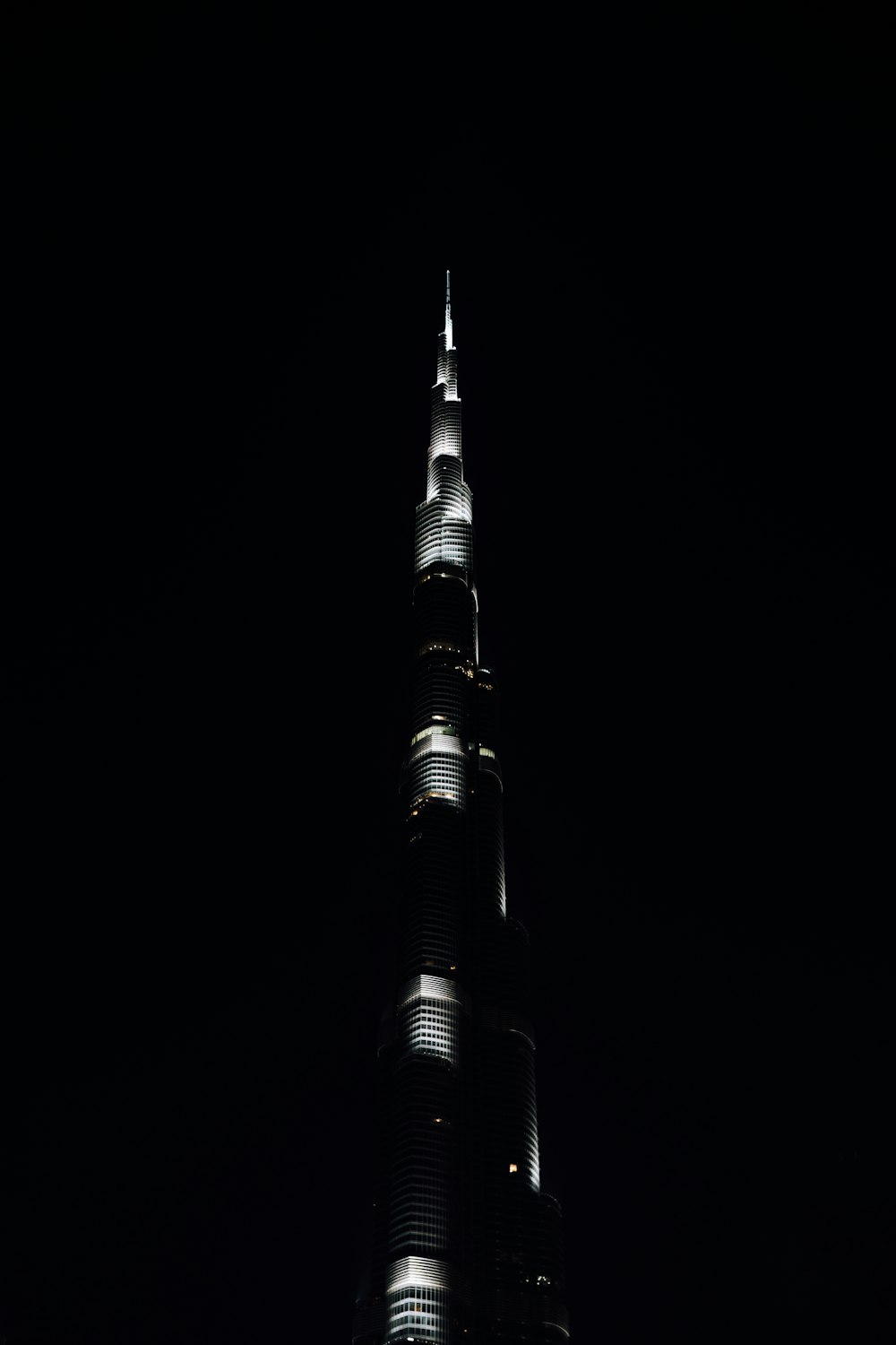 a very tall building lit up at night