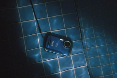 blue point-and-shoot camera