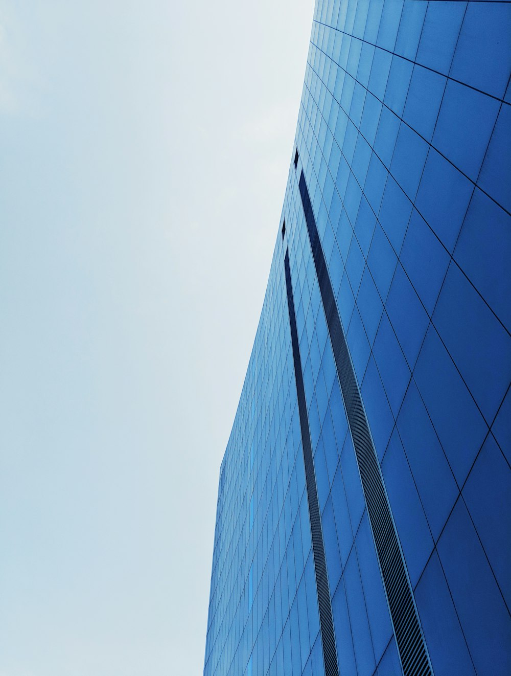 low-angle photography of curtain wall building